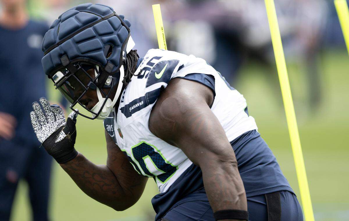 Seattle Seahawks defensive tackle Jarran Reed (90) runs drills during training camp at Virginia Mason Athletic Center on Friday, July 25, 2025, in Renton, Wash.