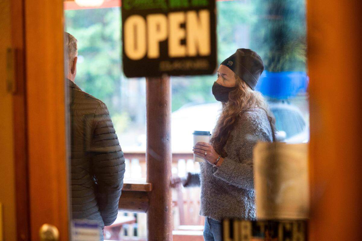 Maureen Gilbert, owner of Alta Crystal Resort, drinks a coffee at Greenwater Outfitters on Friday, Oct. 23, 2020.