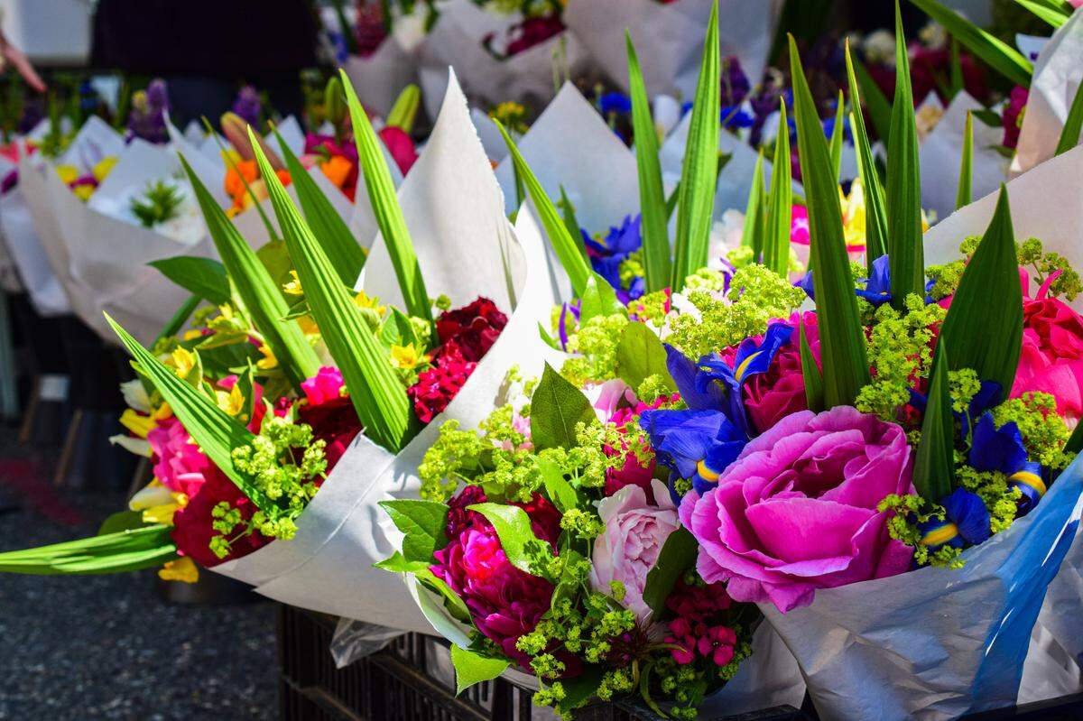 Bouquets bursting with color, often curated by Hmong vendors, are a common sight at South Sound farmers markets.