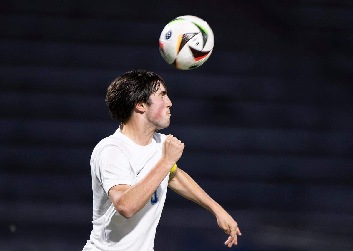 Curtis defender Ethan Bell (9) heads the ball during the 4A District Boys Soccer Championship match against Sumner at Auburn Memorial Stadium, on Thursday, May 9, 2024, in Auburn, Wash.