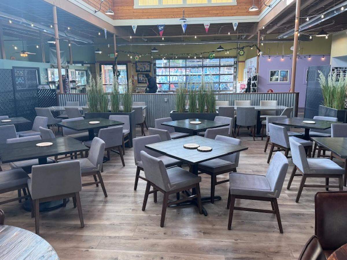 Tables await customers inside Rustica Grille, a new steakhouse that opened Wednesday, March 11, 2026 in Port Orchard, Wash.