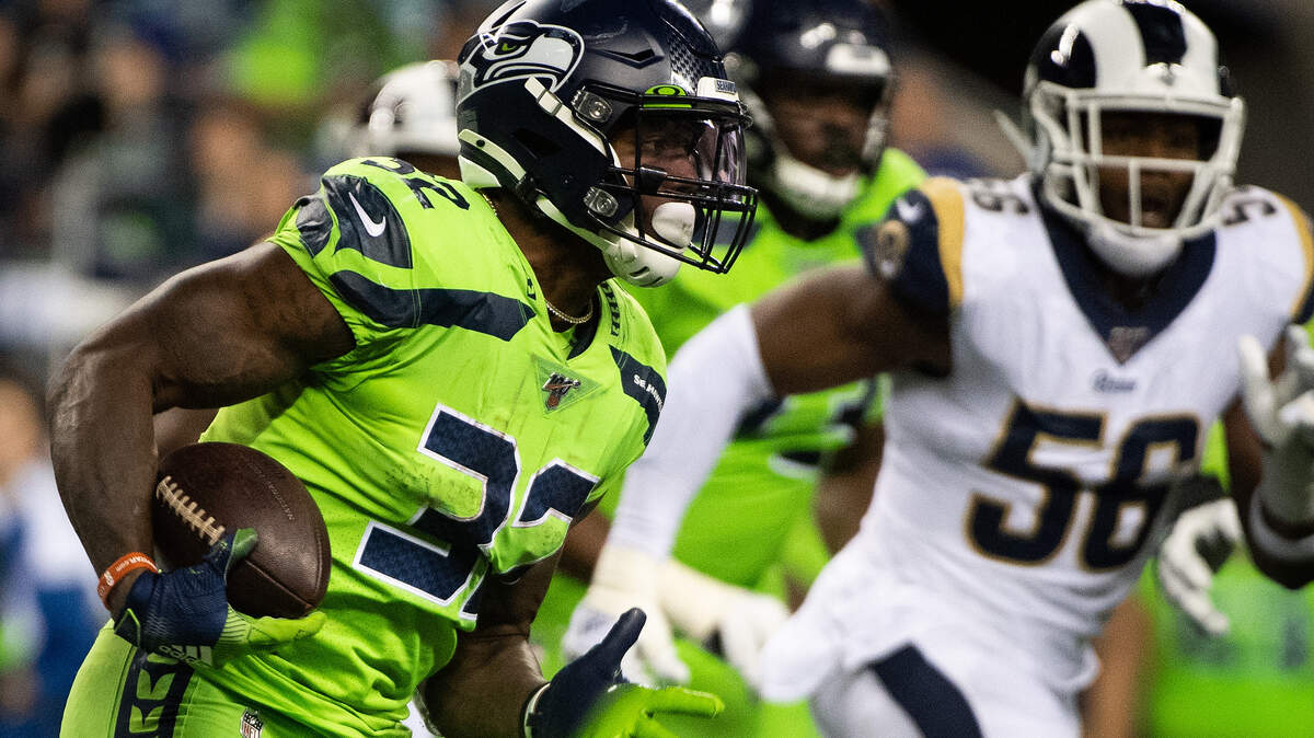 Seattle Seahawks running back Chris Carson (32) rushes during the third quarter. The Seattle Seahawks played the Los Angeles Rams in a NFL football game at CenturyLink Field in Seattle, Wash., on Thursday, Oct. 3, 2019.