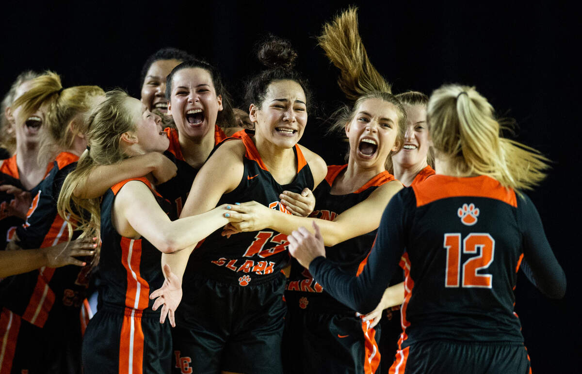 Lewis and Clark players celebrate after their win. Kentridge played Lewis and Clark in a basketball game at the Hardwood Classic State Basketball Tournament at the Tacoma Dome in Tacoma, Wash., on Friday, March 1, 2019.