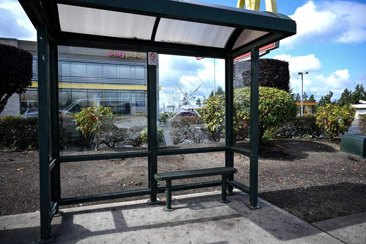A broken pane of glass at a vandalized bus shelter on Pacific Avenue South, Wednesday, Sept. 20, 2023, in Tacoma. Pierce Transit crews work on dozens of bus shelters every day.