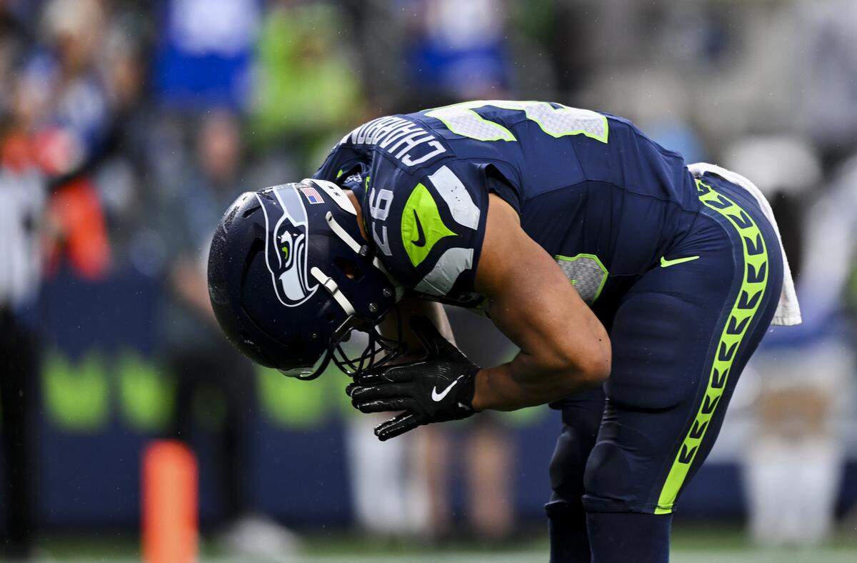 Seattle Seahawks running back Zach Charbonnet (26) bows after scoring a touchdown during the first quarter of the preseason game against the Kansas City Chiefs at Lumen Field, on Friday, Aug. 15, 2025, in Seattle.