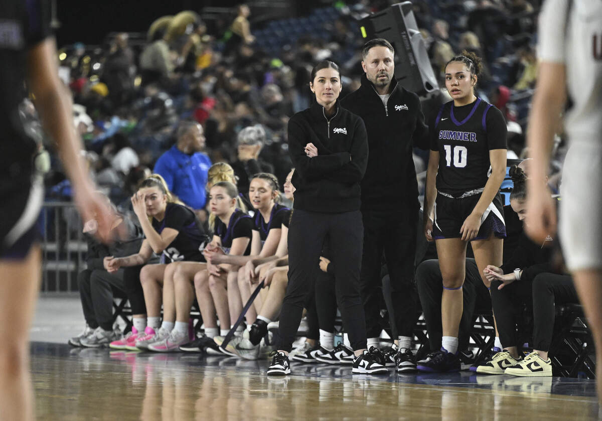 Sumner head coach Katie Hyppa, left, watches from the sidelines during the quarterfinal round of the 4A State Tournament against Union at the Tacoma Dome, on Thursday, March 5, 2026, in Tacoma, Wash.
