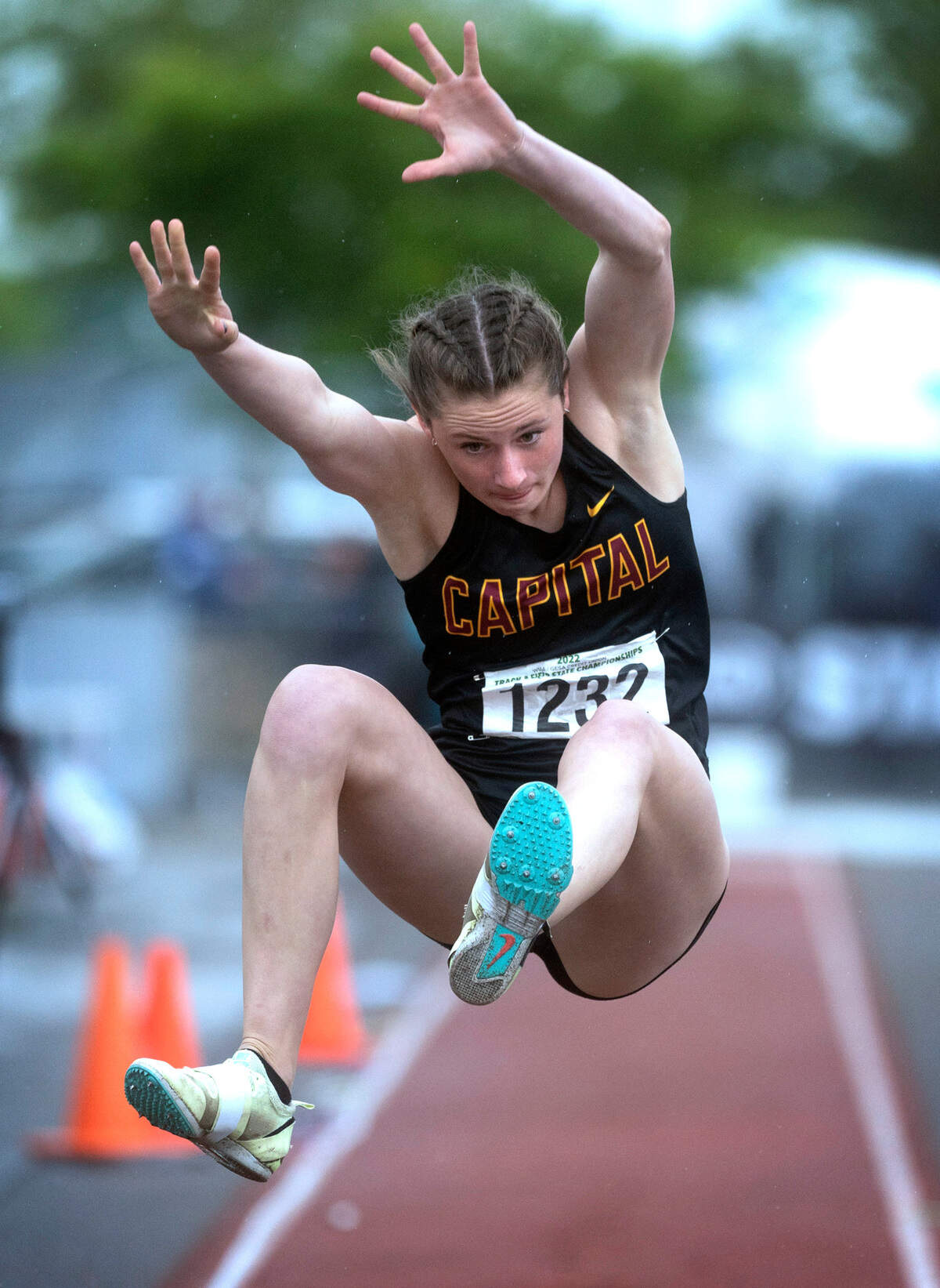 Capital’s Amanda Moll leaps to her third state championship of the weekend in the 3A girls long jump competition during the final day of the WIAA State Track and Field Championships at Mount Tahoma High School in Tacoma, Washington on Saturday, May 28, 2022. Moll also earned the state championships in the pole vault and as a member of the 400-meter relay team.