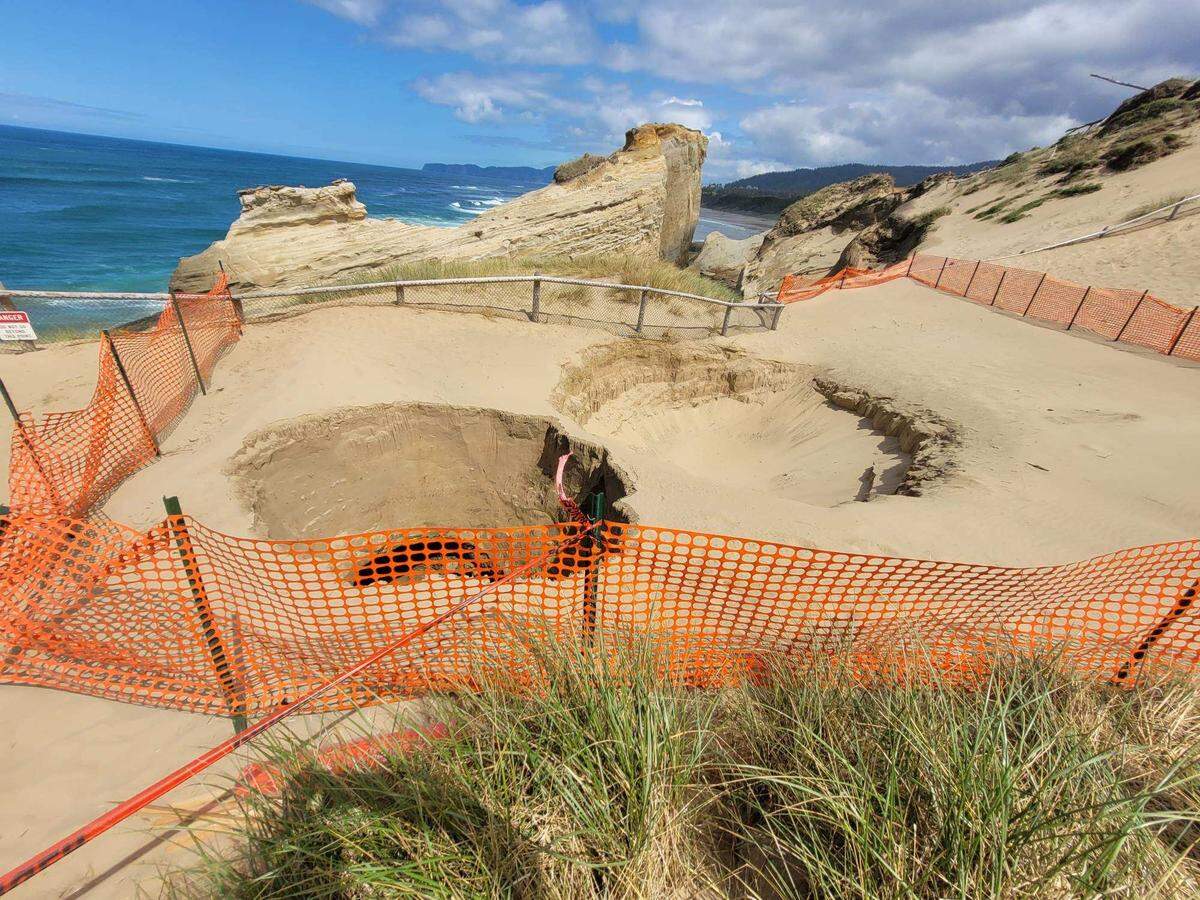 A second sinkhole formed inches away from another sinkhole May 8 at the Cape Kiwanda State Natural Area, park officials said. The latest sinkhole is 10 feet wide and 30 feet deep.