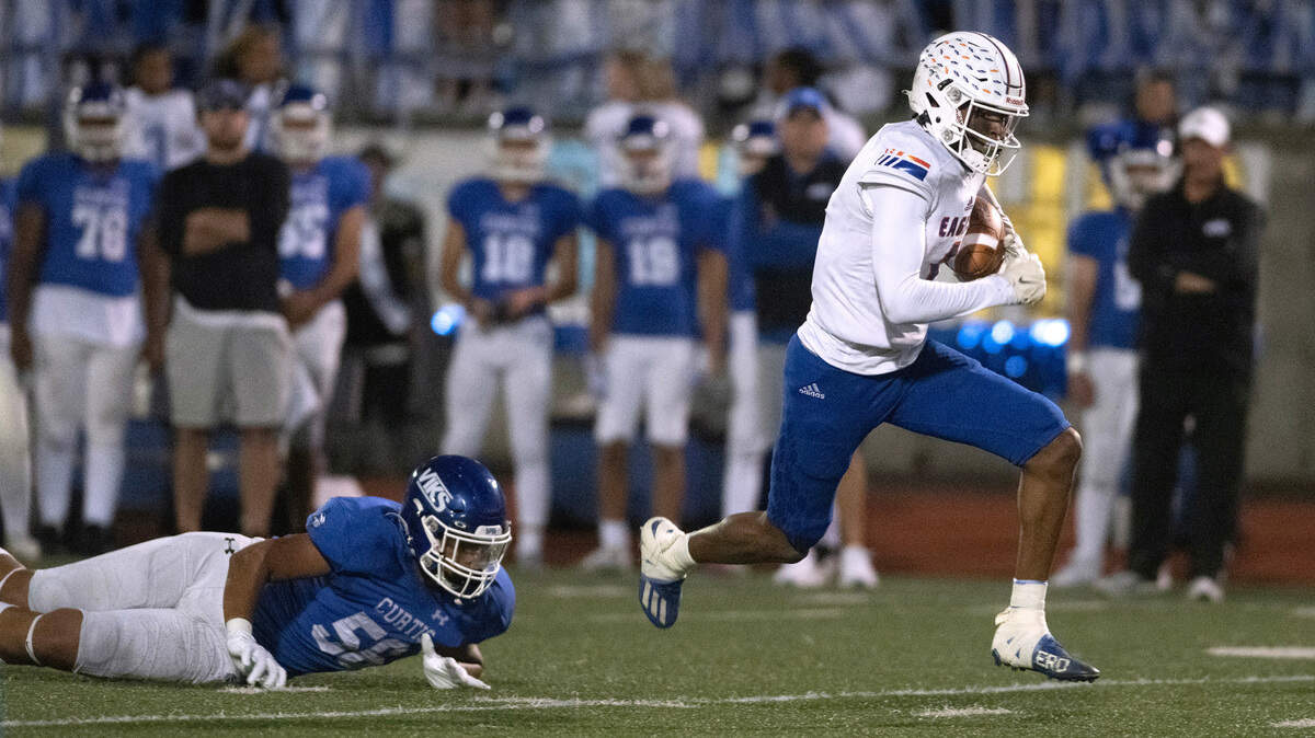 Graham Kapowsin wide receiver Malachi Durant breaks away from Curtis defensive lineman Kingston Kerkhoff during Friday night’s 4A SPSL football game at Viking Stadium in University Place, Washington, on Oct. 6, 2023. Graham Kapowsin won the game, 42-35.