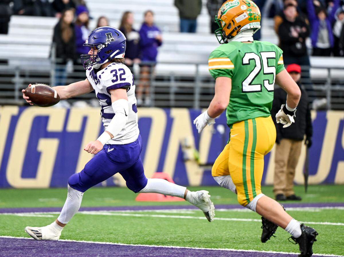 Anacortes’s Brock Beaner (32) runs in a touchdown against Tumwater during the first half of the 2A state championship game at Husky Field, Saturday, Dec. 2, 2023, in Seattle, Wash.