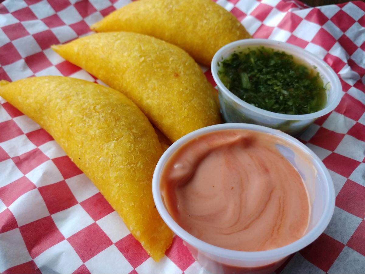 Empanadas come with a three different dipping sauces at Sabor Colombiano Luis Panes Empanadas in Tacoma.