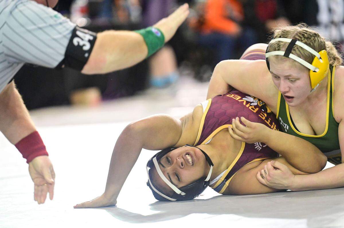 White River’s Jalia Williams reacts after getting pinned by Richland’s Hailey Ahsmuhs during their 170-pound girls semifinal match at Mat Classic XXXIII on Saturday, Feb. 19, 2022, at the Tacoma Dome in Tacoma, Wash. Ahsmuhs pinned Williams in 1 minute, 29 seconds.