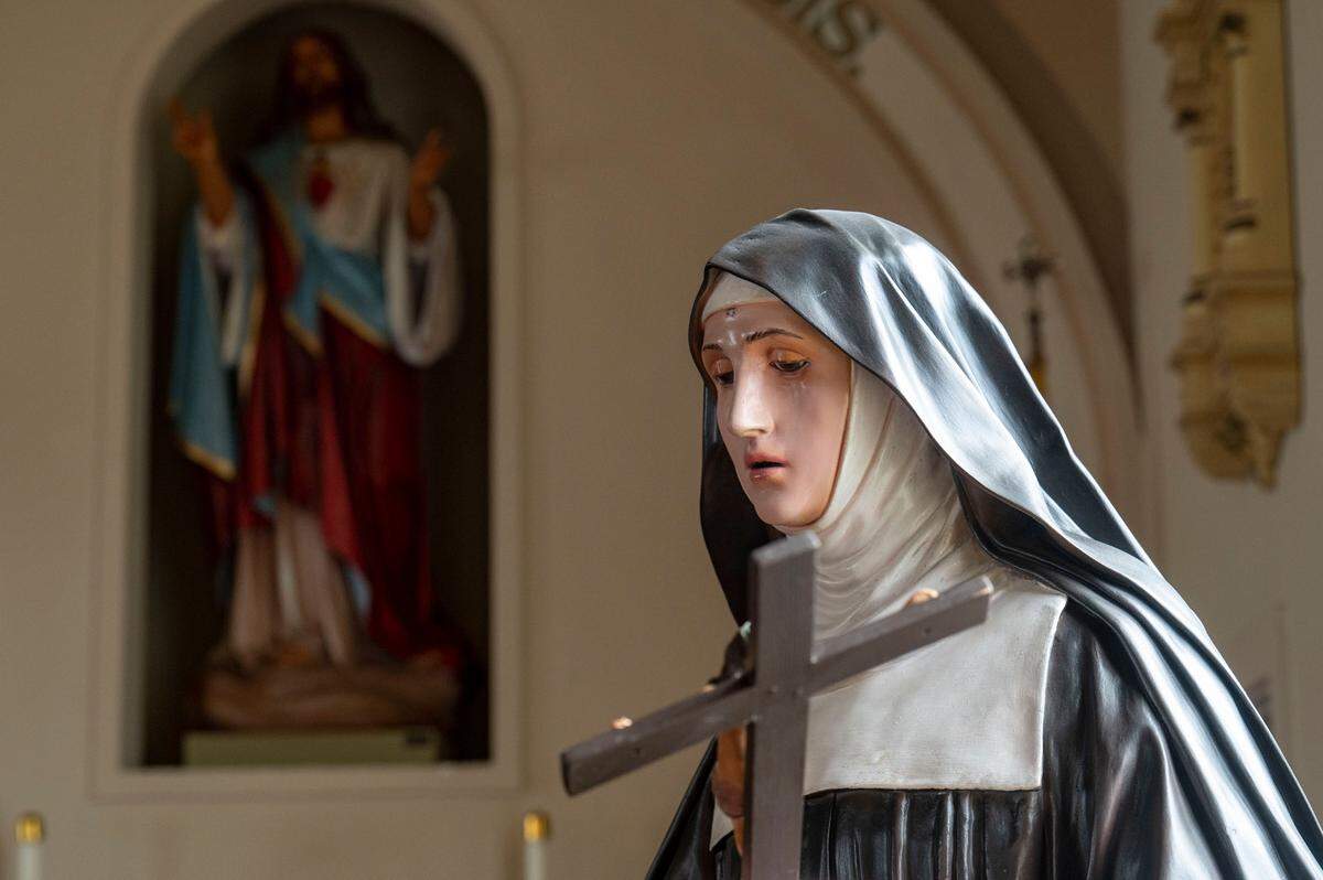 One of the many statues inside the church is one of St. Rita that stands prominently in front just to the right of the altar.