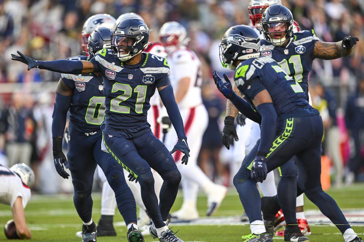 Seattle Seahawks cornerback Devon Witherspoon (21) leads the celebration after he sacked New England Patriots quarterback Drake Maye (10) during the first quarter of Super Bowl LX at Levi's Stadium on Feb. 8, 2026 in Santa Clara, Calif.