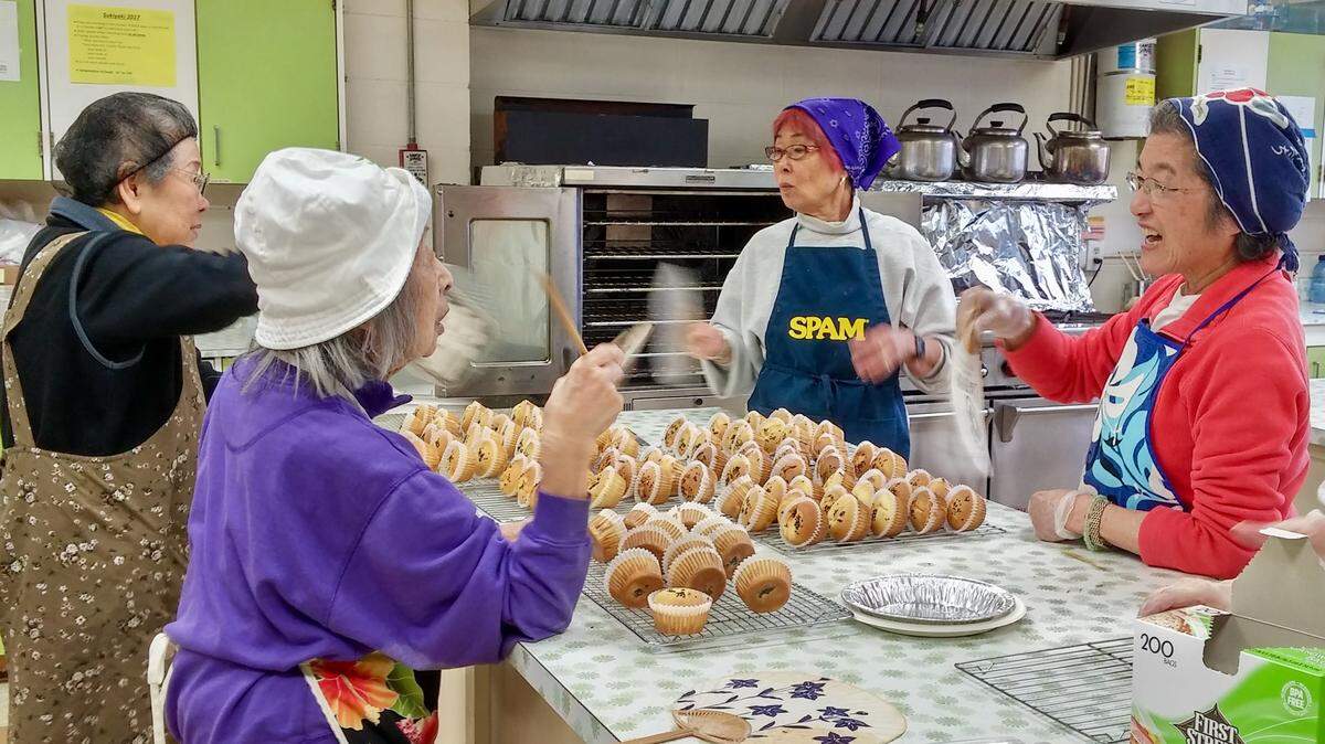 Volunteers at the Tacoma Buddhist Temple bake hundreds of mochi cupcakes from scratch for the annual sukiyaki lunch.