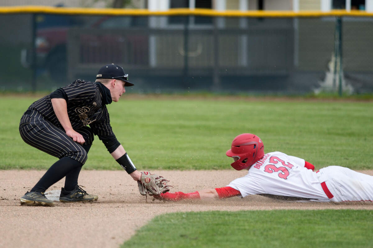 Enumclaw High School shortstop Cole Kaschmitter tags out Micah Bujacich during the Class 2A South Puget Sound League championship game against Steilacoom on Saturday, May 8, 2021 at Osborne Field in Enumclaw, Wash.