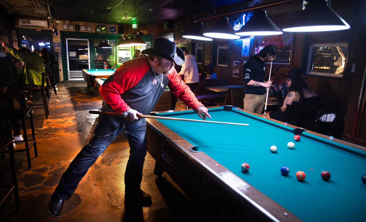 Jerry Miller of Tacoma plays pool with friends at the Unicorn Sports Bar & Grill in Ruston, Washington, Friday, Oct. 25, 2024.