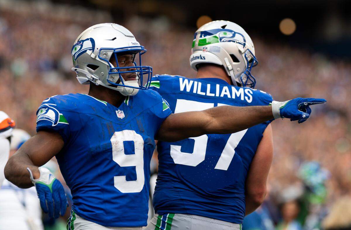 Seattle Seahawks running back Kenneth Walker III (9) reacts to a touchdown that will be called back on a offensive holding call on wide receiver DK Metcalf (14) during the third quarter of the game at Lumen Field, on Sunday, Sept. 8, 2024, in Seattle, Wash.