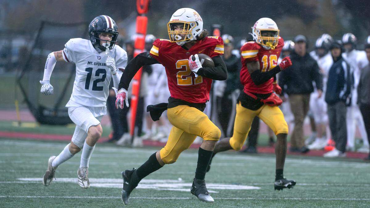 Mount Tahoma running back Tyrone Walker breaks loose in front of Mount Spokane defensive back Quincy Malacas during Saturday afternoon’s 3A playoff football game at Mount Tahoma High School in Tacoma, Washington, on Nov. 9, 2024. Malacas stripped the ball from Walker just short of the goal line, resulting in a touchback for Mount Spokane. Mount Tahoma won the game, 35-13.