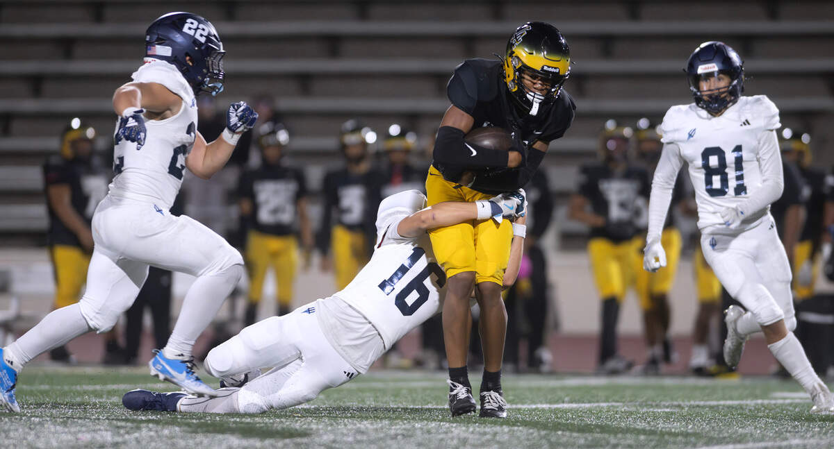 Lincoln wide receiver Kasey Williams pulls in a pass over Gig Harbor defensive back Taylor Carey during Friday night’s 3A South Sound League football game at Lincoln Bowl in Tacoma, Washington, on Sept. 27, 2024.