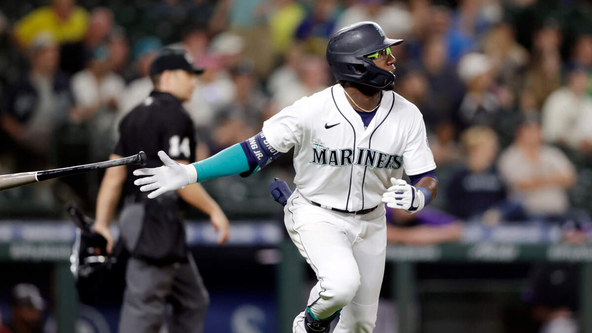 Seattle Mariners’ Shed Long Jr. tosses his bat after hitting a solo home run on a pitch from Colorado Rockies’ Tyler Kinley during the eighth inning of a baseball game, Tuesday, June 22, 2021, in Seattle. The Mariners won 2-1. (AP Photo/John Froschauer)