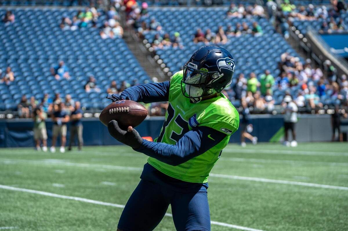 Seattle Seahawks strong safety Jamal Adams catches a ball thrown by quarterback Drew Lock during warm-ups before their practice game on Saturday, Aug. 6, 2022 at Lumen Field in Seattle, Wash.
