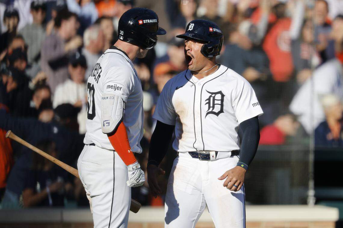 Oct 8, 2025; Detroit, Michigan, USA; Detroit Tigers right fielder Jahmai Jones (18) is greeted by right fielder Kerry Carpenter (30) after scoring in the fifth inning against the Seattle Mariners during game four of the ALDS round for the 2025 MLB playoffs at Comerica Park. Mandatory Credit: Rick Osentoski-Imagn Images