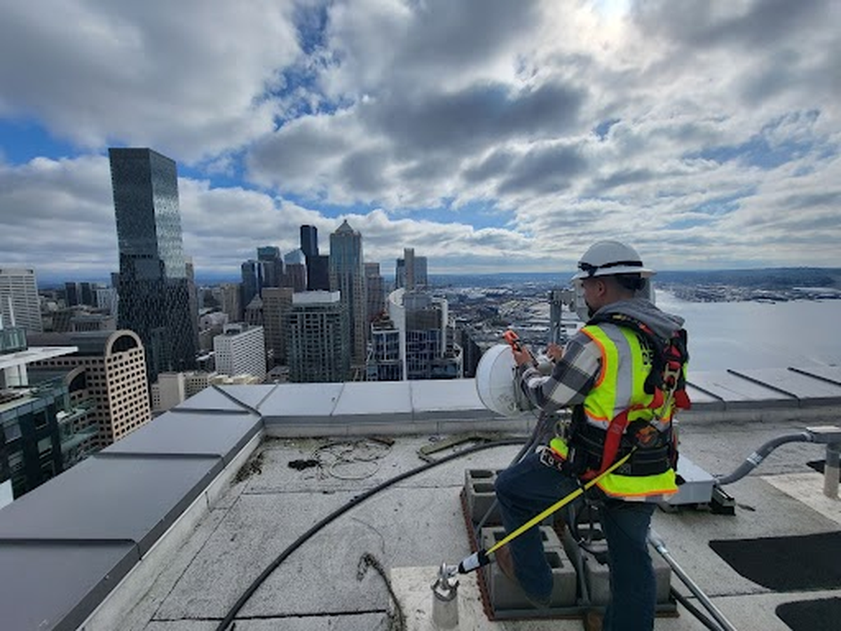 Astound Broadband’s Wireless Network Deployment Team installed systems on rooftops in Seattle similar to the one that was going to be deployed to Herron Island, allowing customers high-speed internet access. Astound is canceling their original plan due to permitting delays, a spokesperson told The News Tribune in November 2025.