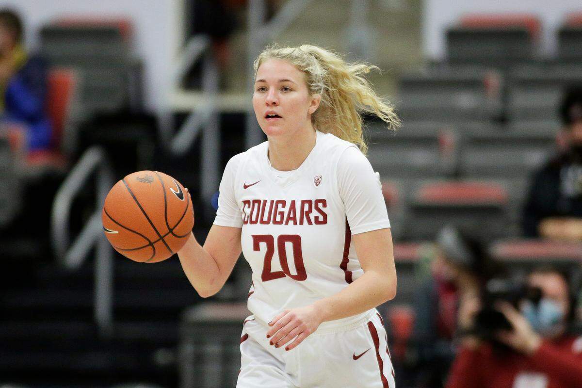 Washington State guard Grace Sarver controls the ball during the first half of an NCAA college basketball game against Stanford, Sunday, Jan. 2, 2022, in Pullman, Wash. (AP Photo/Young Kwak)