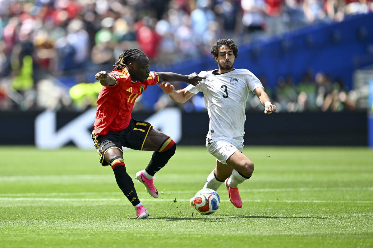 Belgium midfielder Jérémy Doku (11) pulls on Egypt defender Mohamed Hany (3) as they fight for control of the ball on Monday, June 15, 2026, during a FIFA World Cup game in Seattle, Wash.
