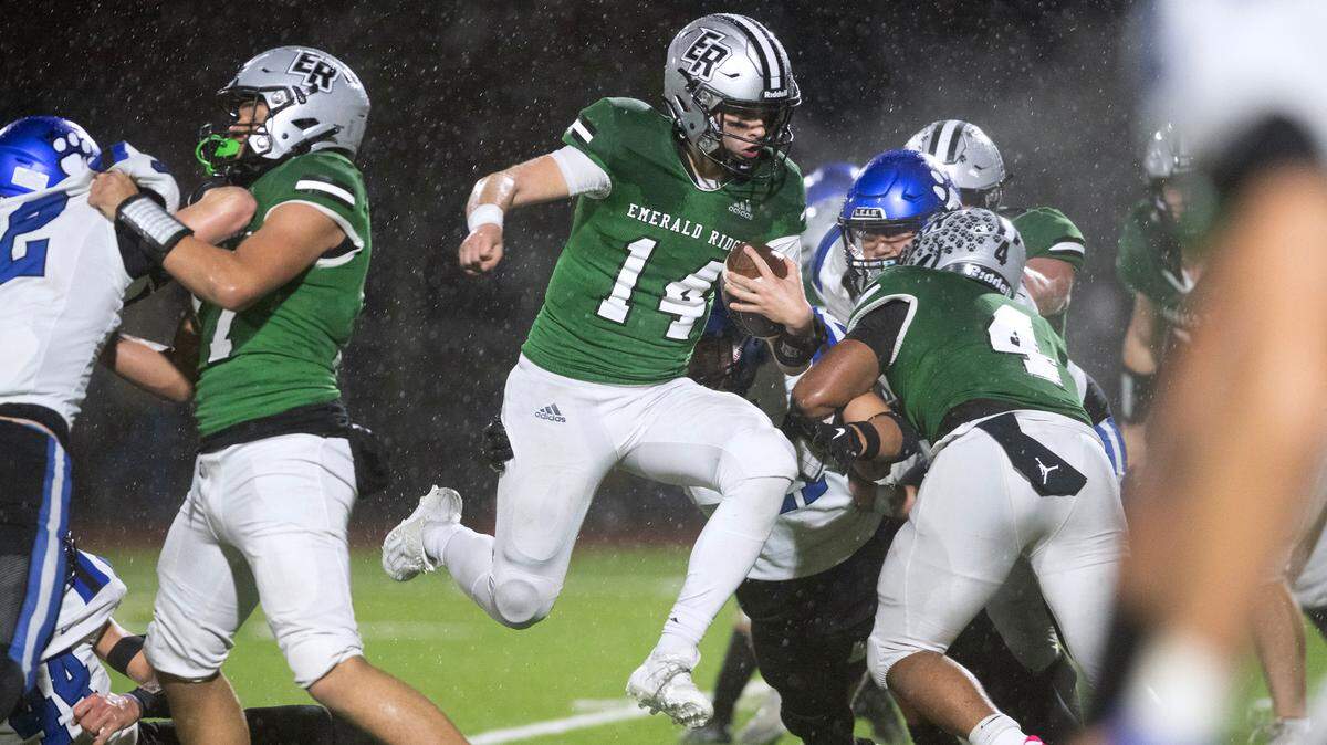 Emerald Ridge quarterback Jake Schakel leaps into the end zone for a two-point conversion during Friday night’s 4A district football game against the Bothell Cougars at Sparks Stadium in Puyallup, Washington, on Nov. 3, 2023. Emerald Ridge won the game, 50-36.