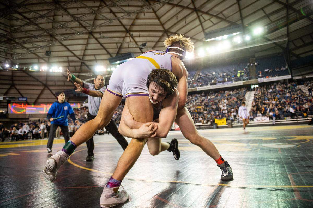 Puyallup’s Isaac Clark wrestles Chiawana’s Tyson Stover in the 4A 182 pound championship during day two of Mat Classic XXXII at the Tacoma Dome in Tacoma, Wash., on Saturday, Feb. 22, 2020.