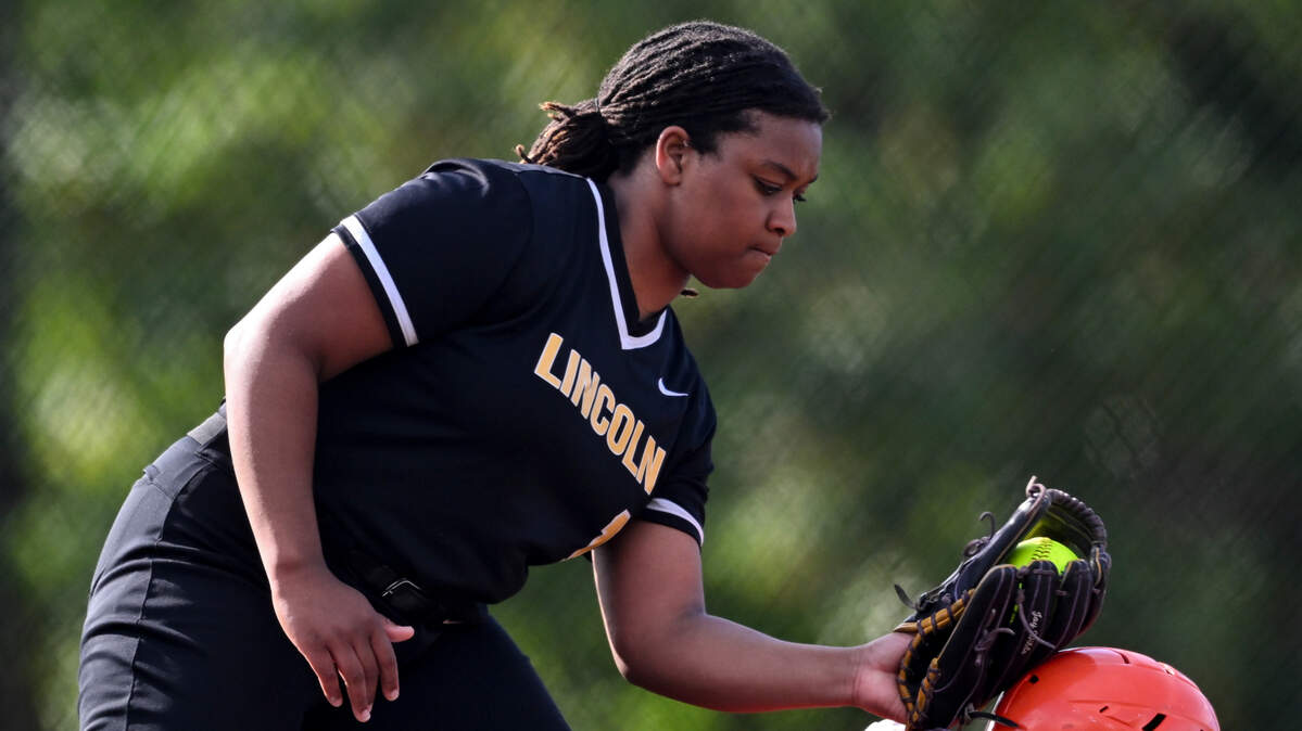 Lincoln’s Joy Wilde tags the helmet of Lakes’ Alannah Martinez, who is ruled safe, during the game at Lincoln High School, on Tuesday, April 30, 2024, in Tacoma, Wash.