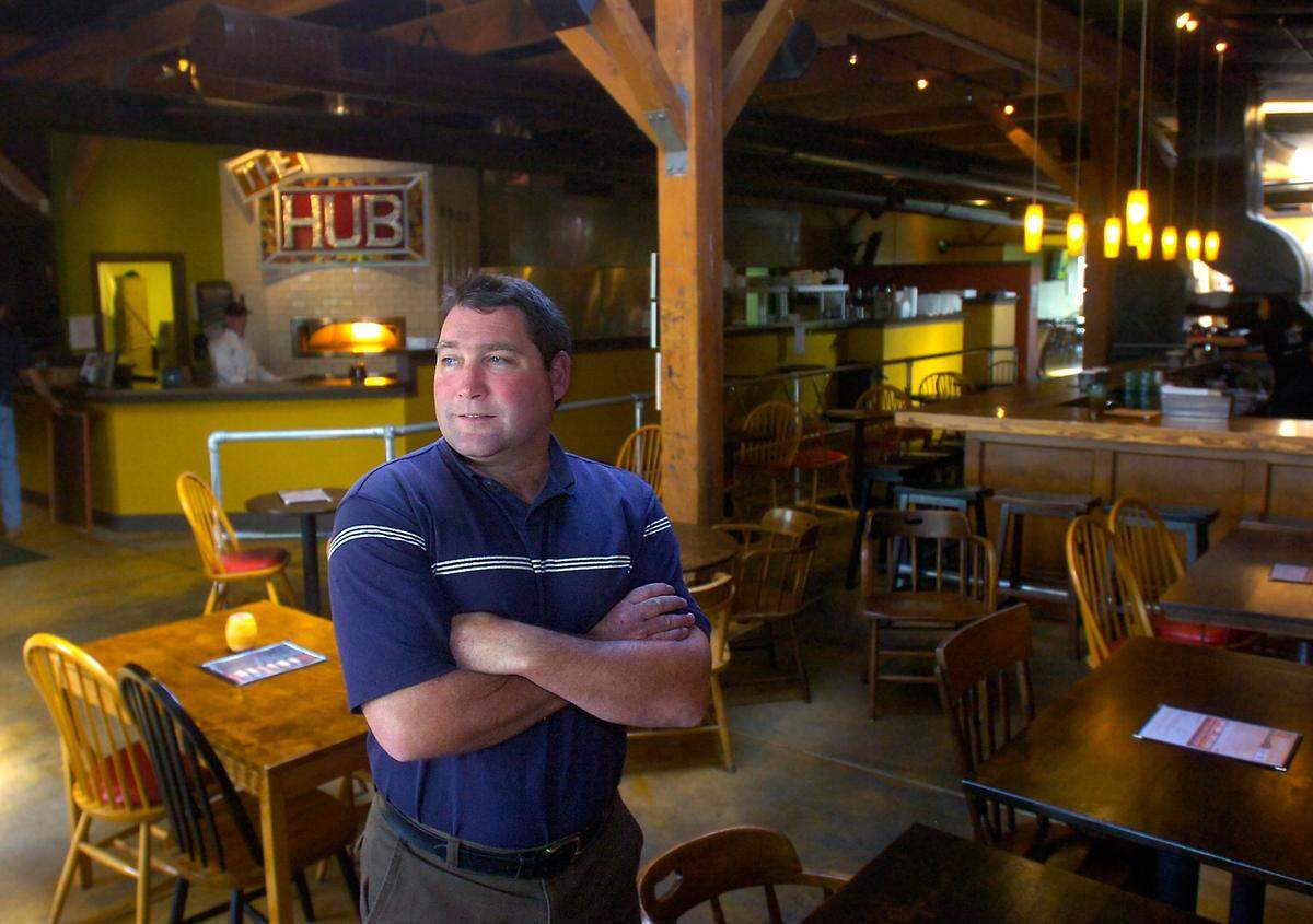 Pat Nagle, former owner of The Harmon and The Hub, stands inside his Stadium area eatery before it opens for lunch in 2011. (Lui Kit Wong/The News Tribune)