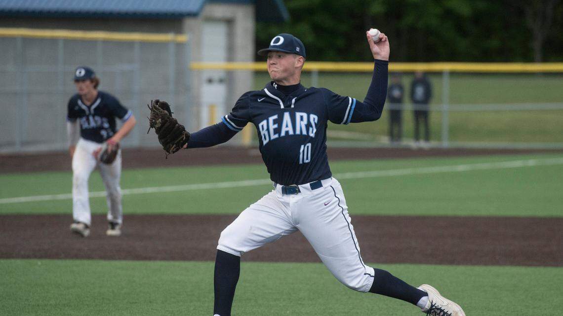 Olympia High School starter Taber Fast throws a pitch during the Class 4A West Central/Southwest bidistrict championship game on Saturday, May 14, 2022 at Kent-Meridian High School in Kent, Wash. Olympia beat Puyallup, 8-4, to win the title.
