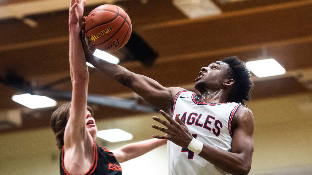 Life Christian’s guard Bradley Swillie (4) shoots the ball as Zillah’s forward Luke Navarre (34) tries to block him during the high school boys 1A basketball state tournament regional round game at Foss High School in Tacoma, Wash. on Saturday, Feb. 26, 2022.