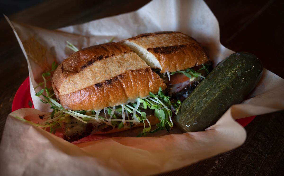 Every sandwich comes on a long roll, available as a half or a whole, and everyone gets a whole pickle, made in house.