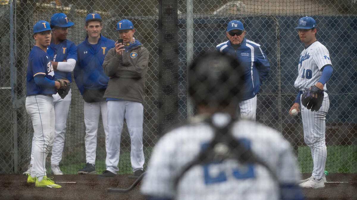 Tahoma and Federal Way starting pitchers Adam Jay (left) and Orlando Young warm up side-by-side before Tuesday afternoon’s baseball game at Federal Way High School in Federal Way, Washington, on Tuesday, April 18, 2023. Tahoma rallied to win the game, 4-2.