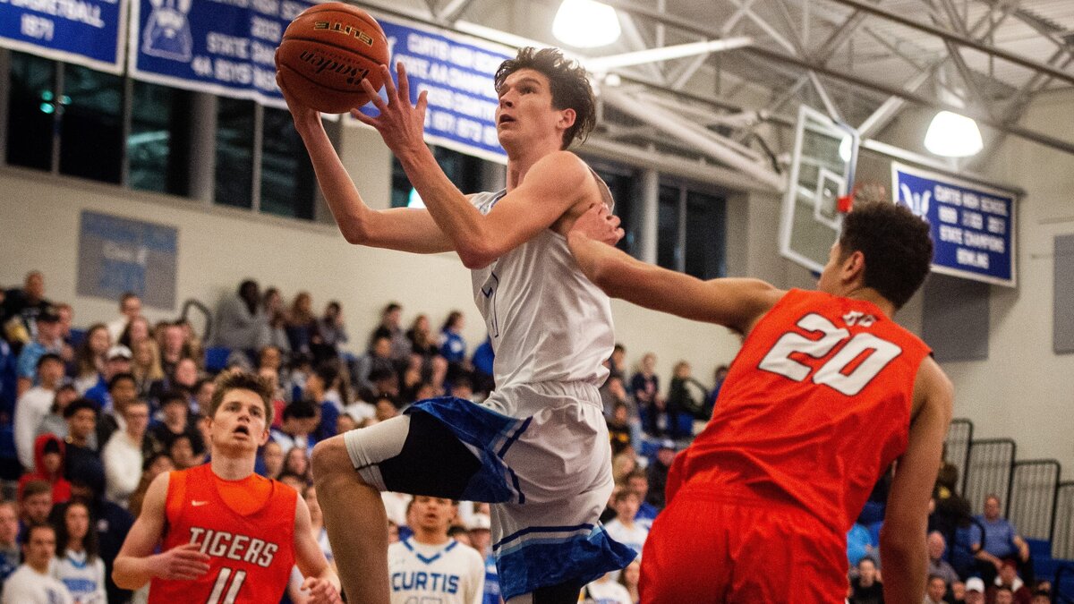 Curtis’ Zack Paulsen drives to the basket and scores in the first quarter. Curtis played Battle Ground in a basketball game at Curtis High School in University Place, Wash., on Thursday, Feb. 7, 2019.