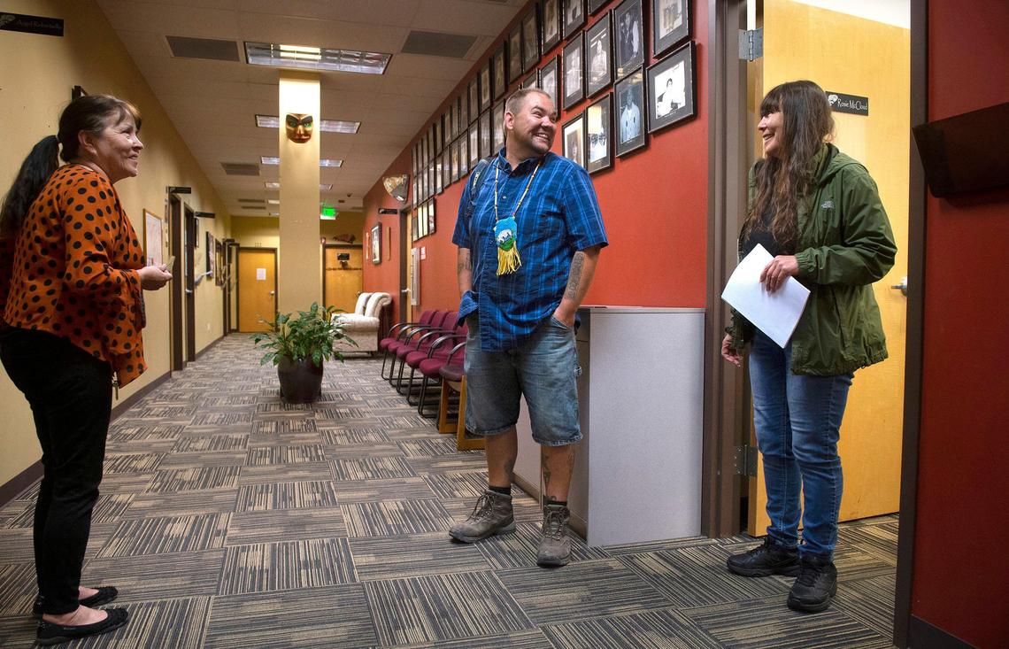 Kristopher Gribben-Earl talks with tribal council secretary Rosie McCloud (left) and youth center director Lisa Earl at the Puyallup Tribal Headquarters in Tacoma on Tuesday July 2, 2019.