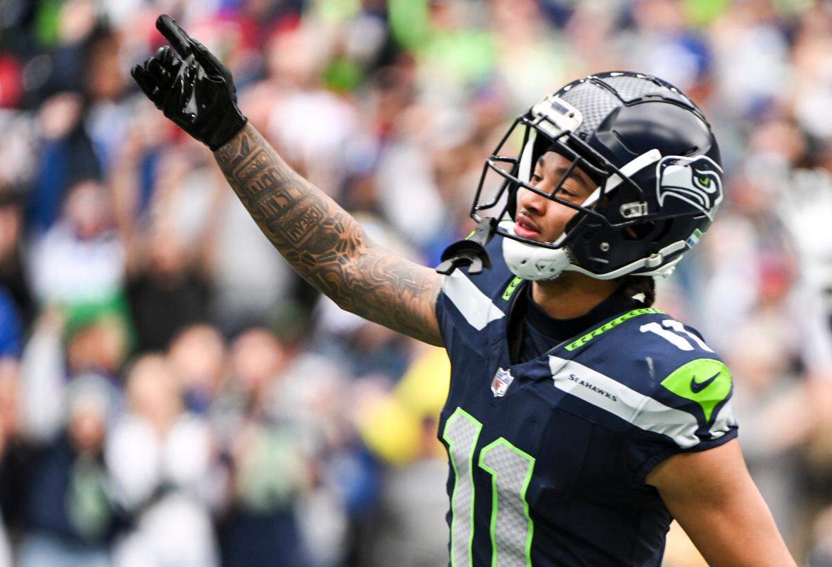 Seattle Seahawks wide receiver Jaxon Smith-Njigba (11) reacts to a touchdown during the first quarter of the game against the Arizona Cardinals at Lumen Field, Sunday, Oct. 22, 2023, in Seattle, Wash.