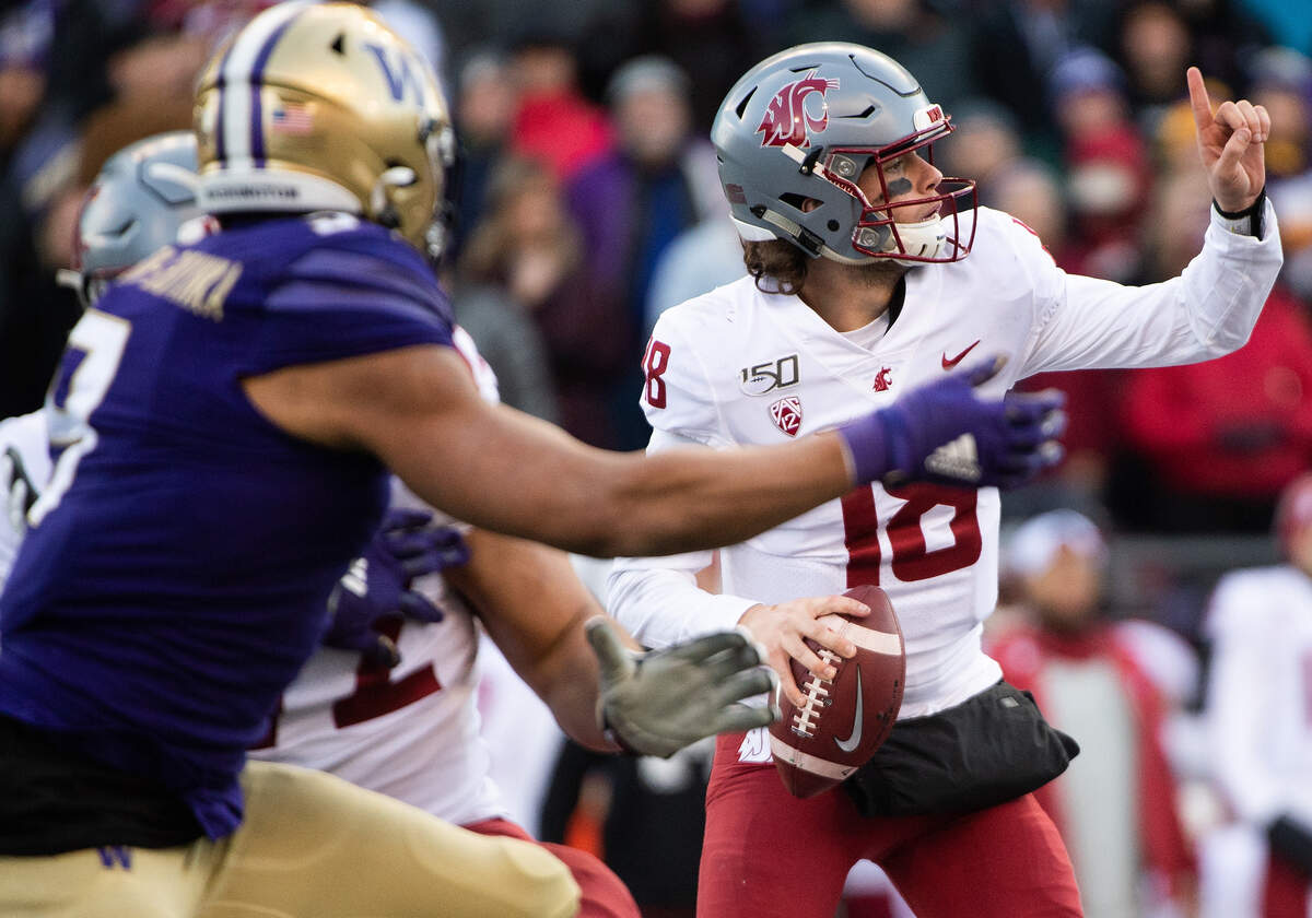 Washington State Cougars quarterback Anthony Gordon (18), looking to throw here against Washington in the Apple Cup at Husky Stadium in November, is reportedly signing with the Seahawks as a rookie free agent.