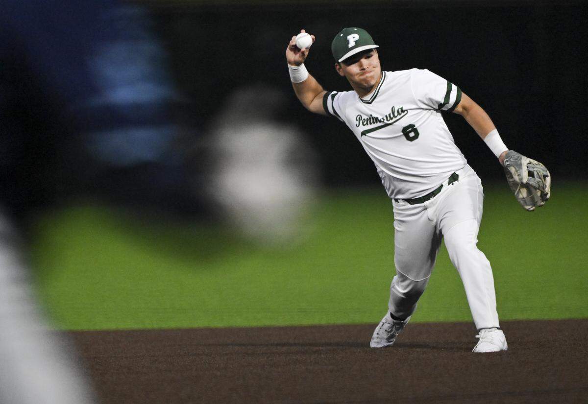 Peninsula's Kainoa Coit (6) throws to first base to retire Gig Harbor’s Hudson Smith (21) during the 3A Puget Sound League baseball league championship game at Lincoln High School, on Wednesday, May 6, 2026, in Tacoma, Wash.