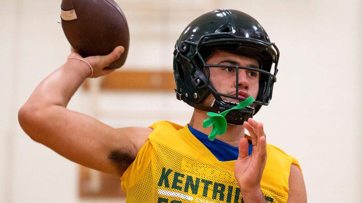 Kentridge quarterback Dorian Thomas throws a pass during practice inside the school’s gym on Wednesday, Sept. 21, 2022, in Kent, Wash. Although Thomas quarterbacks the Chargers, we has committed to Oregon State where he will play tight end.