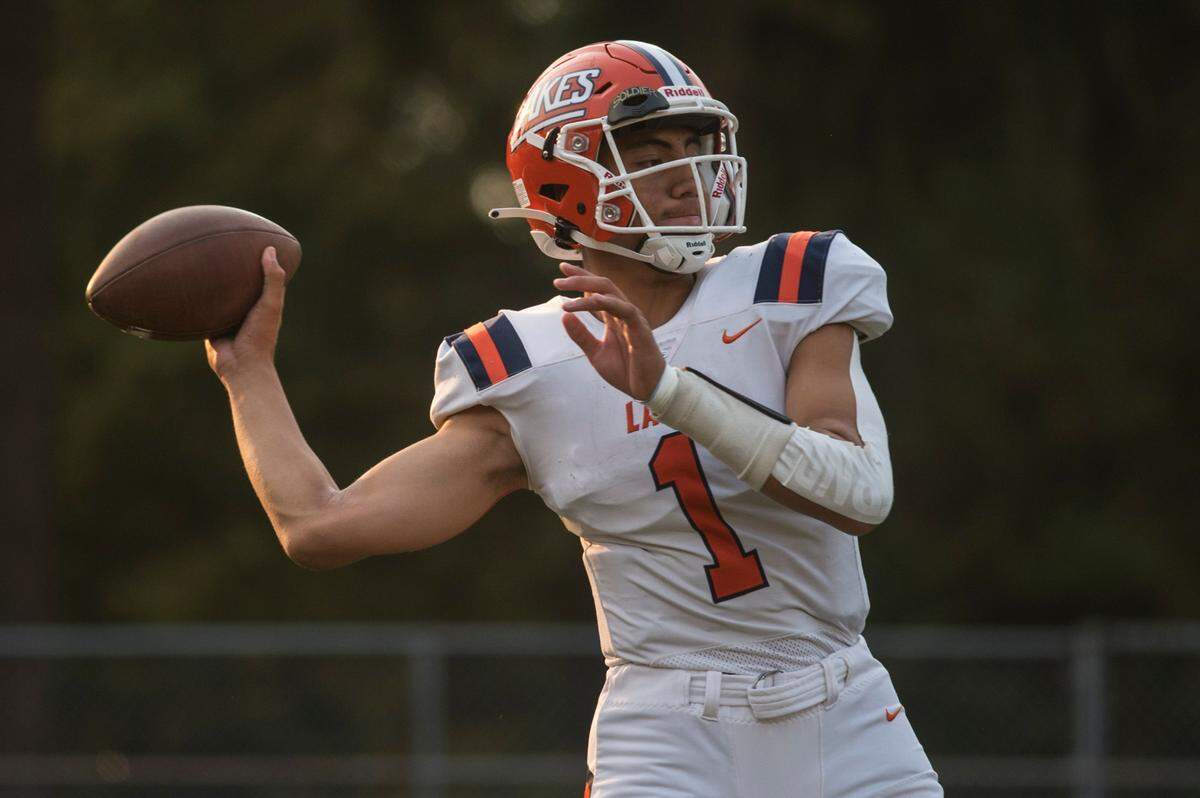 Lakes High School quarterback Legend Galeai (1) warms up before a football game against Kentwood on Friday, Sept. 2, 2022 at French Field in Kent, Wash.