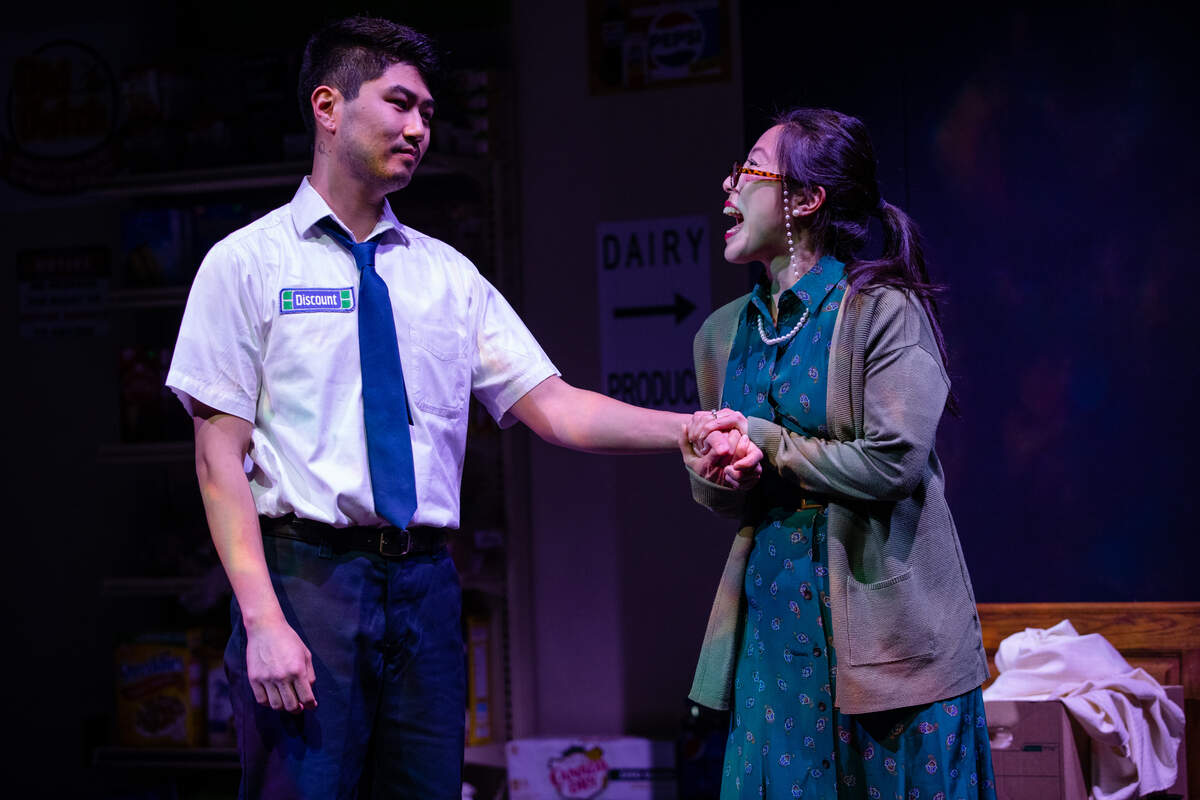 Umma, played by Annie Yim, takes the hand of her son Jung, played by Parker Kennedy, to comfort him as he struggles to figure out why he is unhappy.