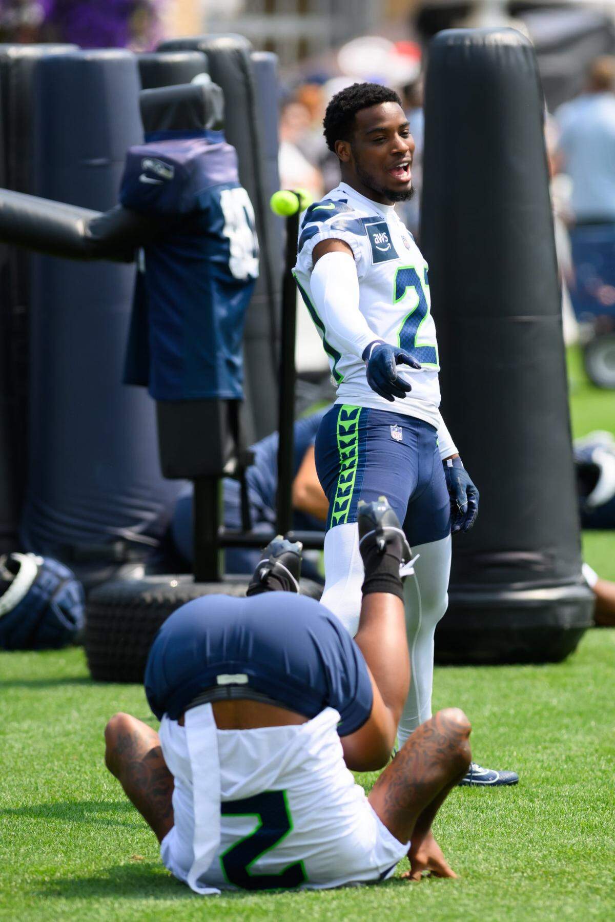 Jul 27, 2024; Renton, WA, USA; Seattle Seahawks cornerback Devon Witherspoon (21) points at safety Rayshawn Jenkins (2) during training camp at Virginia Mason Athletic Center. Mandatory Credit: Steven Bisig-USA TODAY Sports
