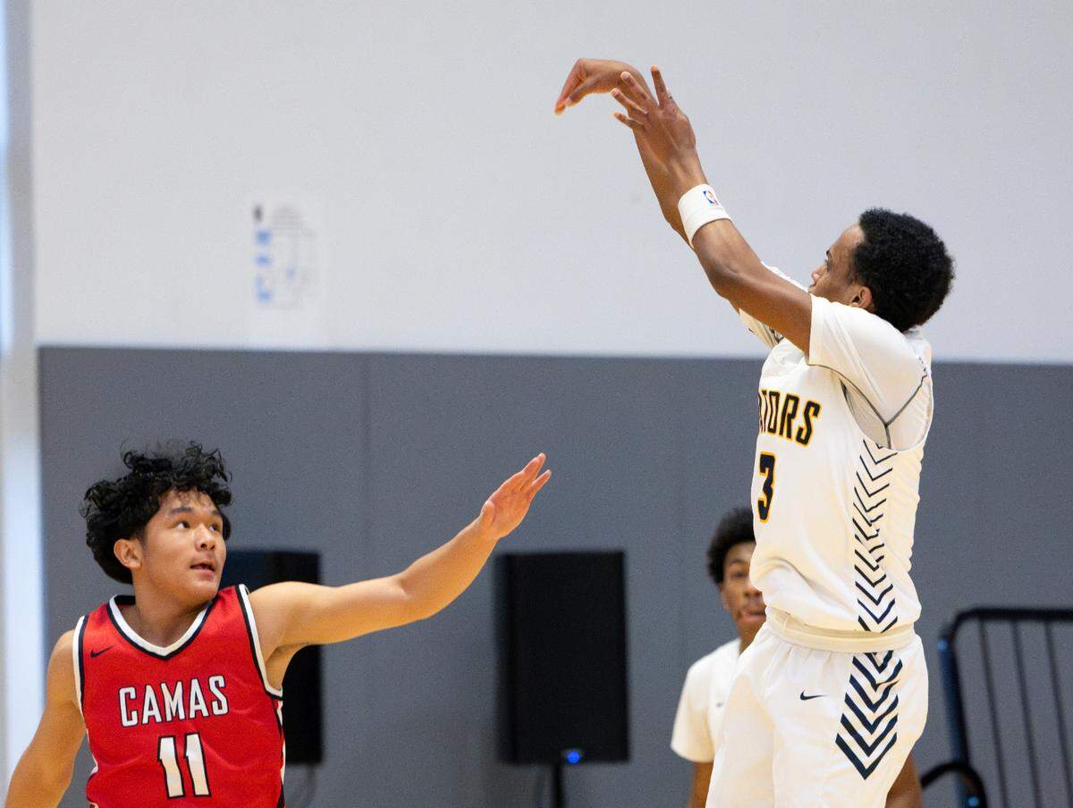 Annie Wright’s Jeremiah Harshman (3) shoots the ball over Camas’ Nyima Namru (11) during the boys basketball game in The Dream Showcase, on Monday, Jan. 15, 2024, in Federal Way, Washington.