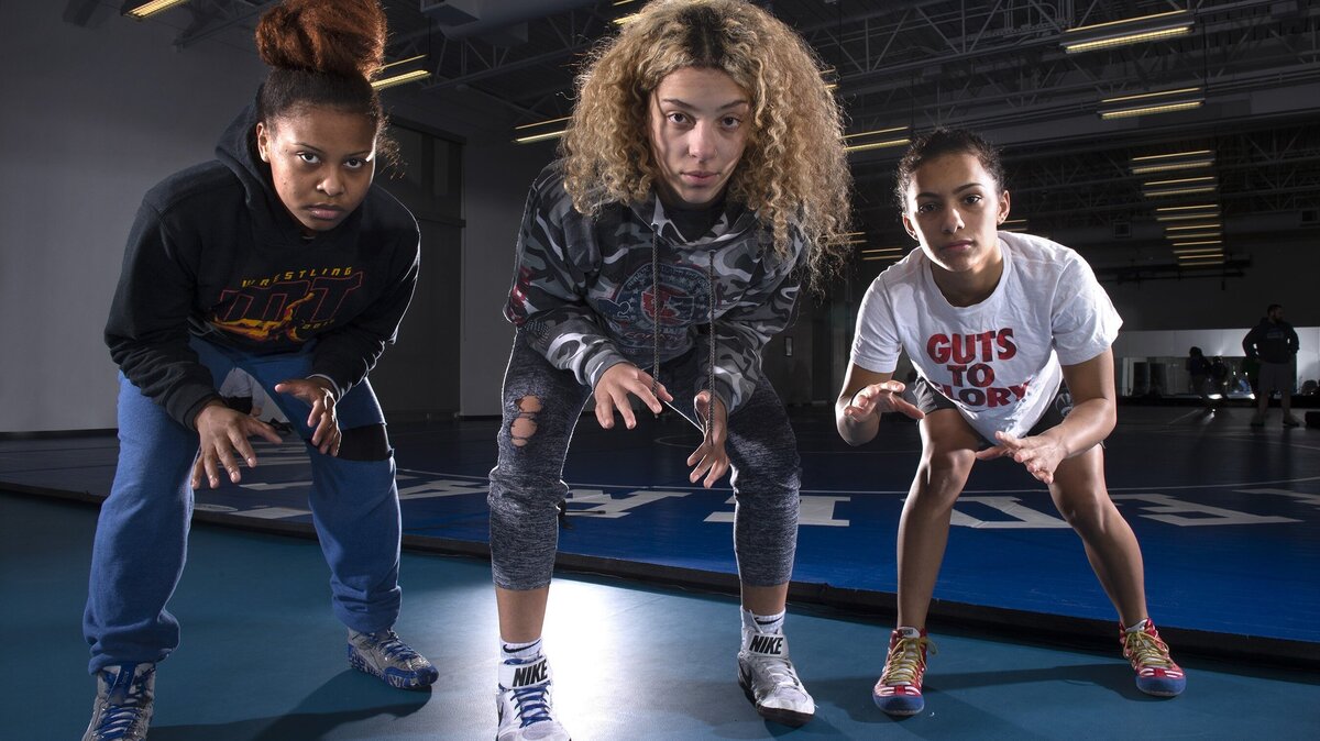 Federal Way senior Anjilia Sumandig (from left), sophomore London Houston and freshman Kayla McKinney-Johnson lead a strong Eagles girls wrestling team. They are shown at Federal Way High School on Wednesday, Jan. 23, 2019.