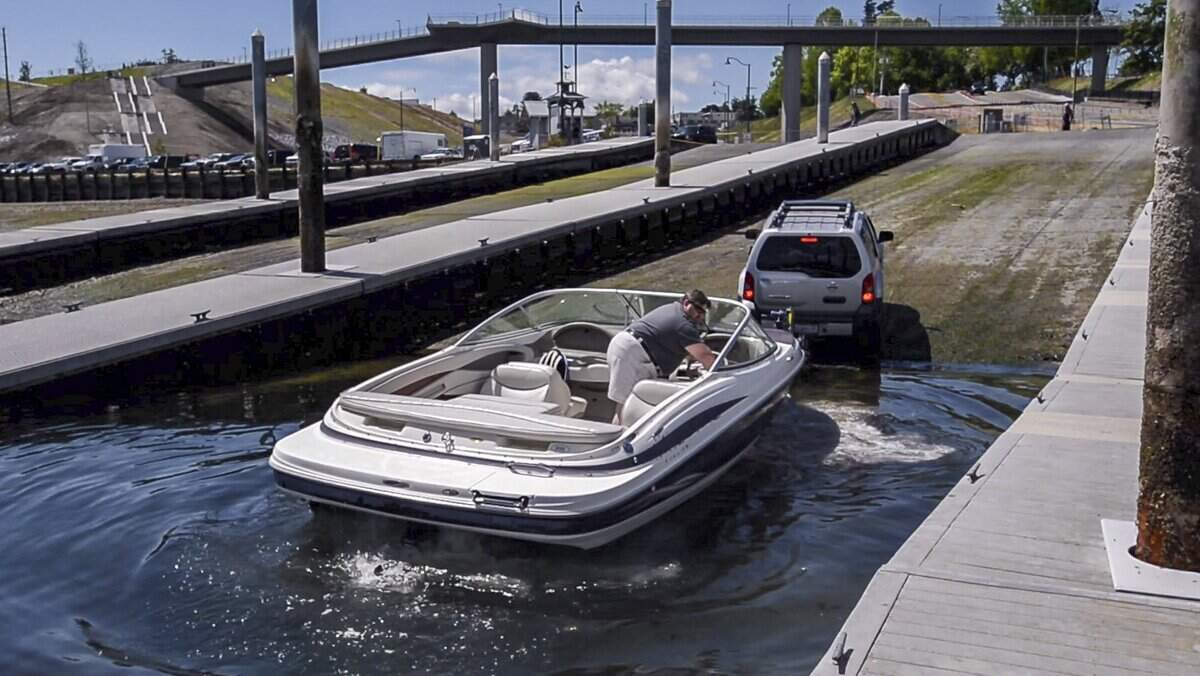 A man launches his boat at Point Defiance, June 15, 2018. Parking at the launch is tricky, with construction projects restricting access.